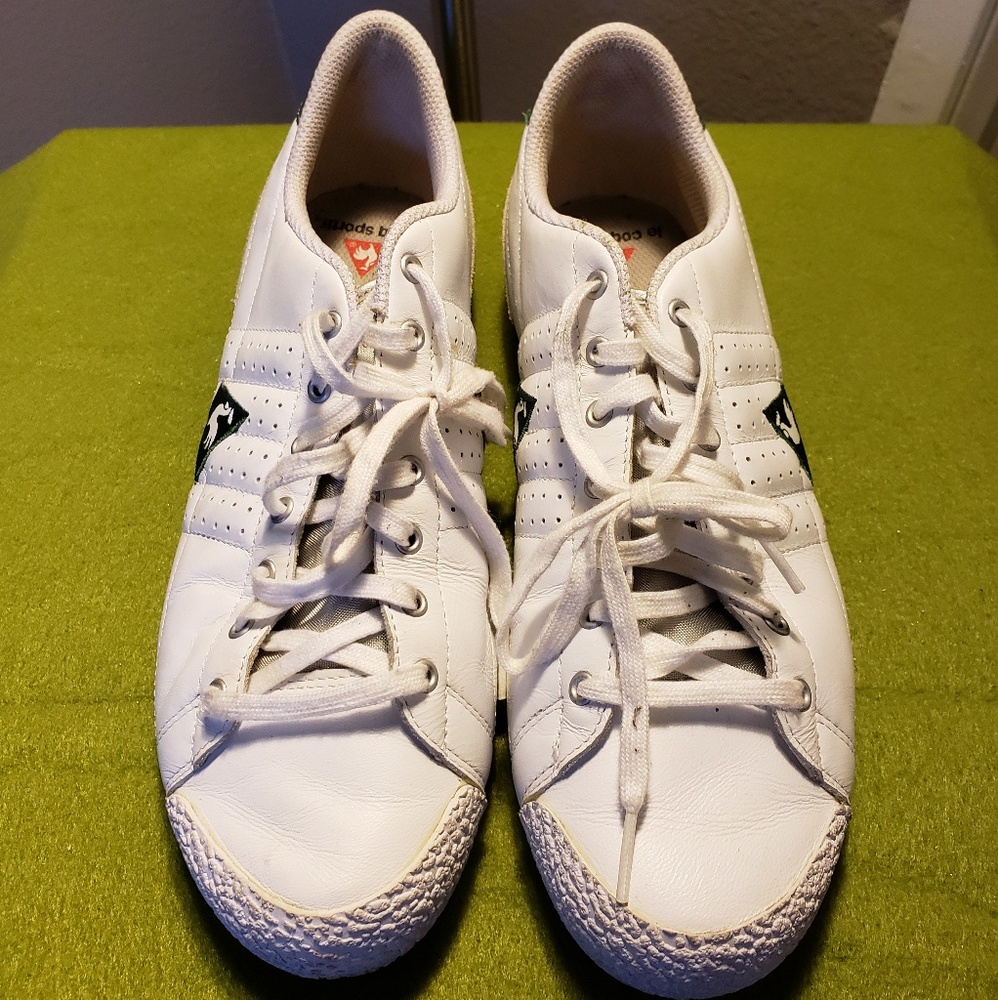 White Le Coq Sportif athletic shoes.